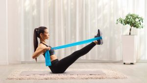 Woman doing exercises with rubber bands